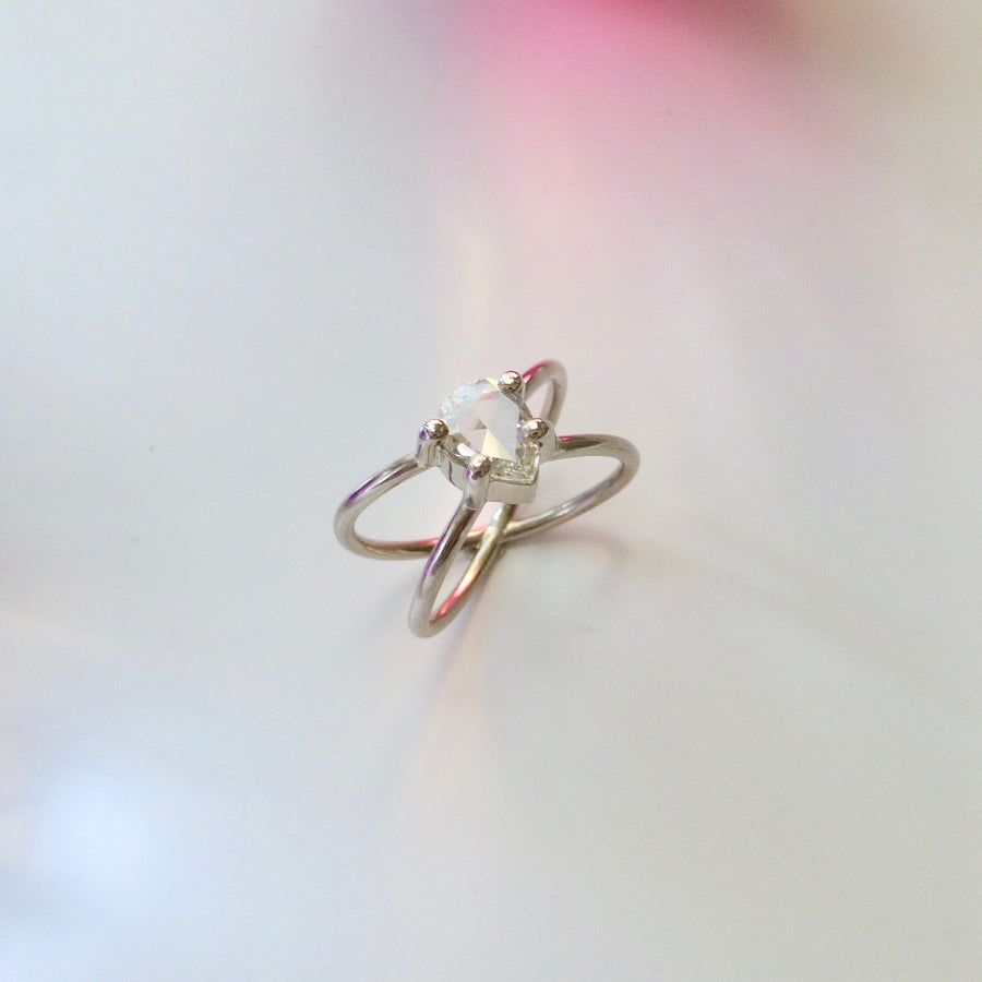 White gold engagement ring with rose cut, pear shaped diamond.