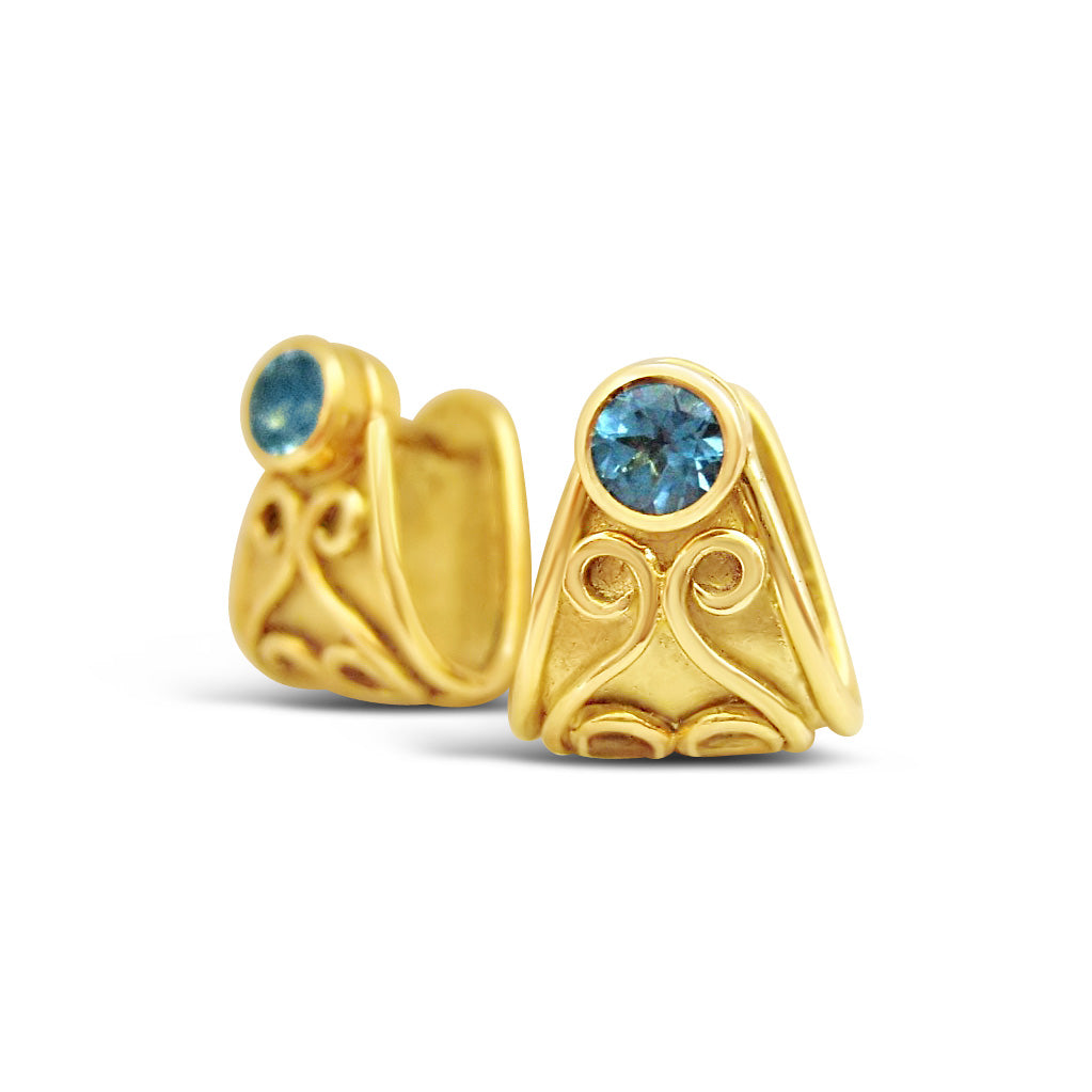 Gold Cuff Earrings with Blue Topaz Gemstones.