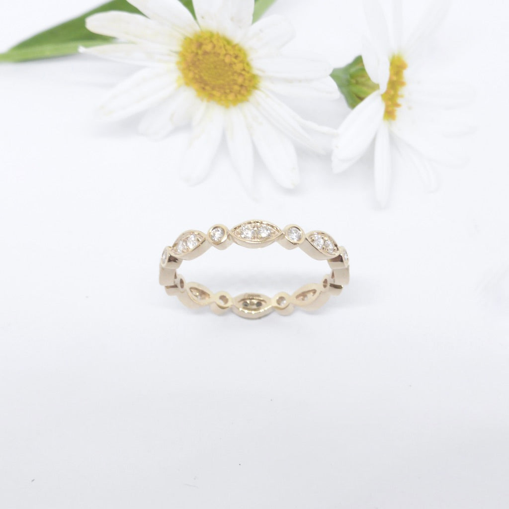 Diamonds set in white gold in feminine wedding ring by Louise Shaw Jewellery