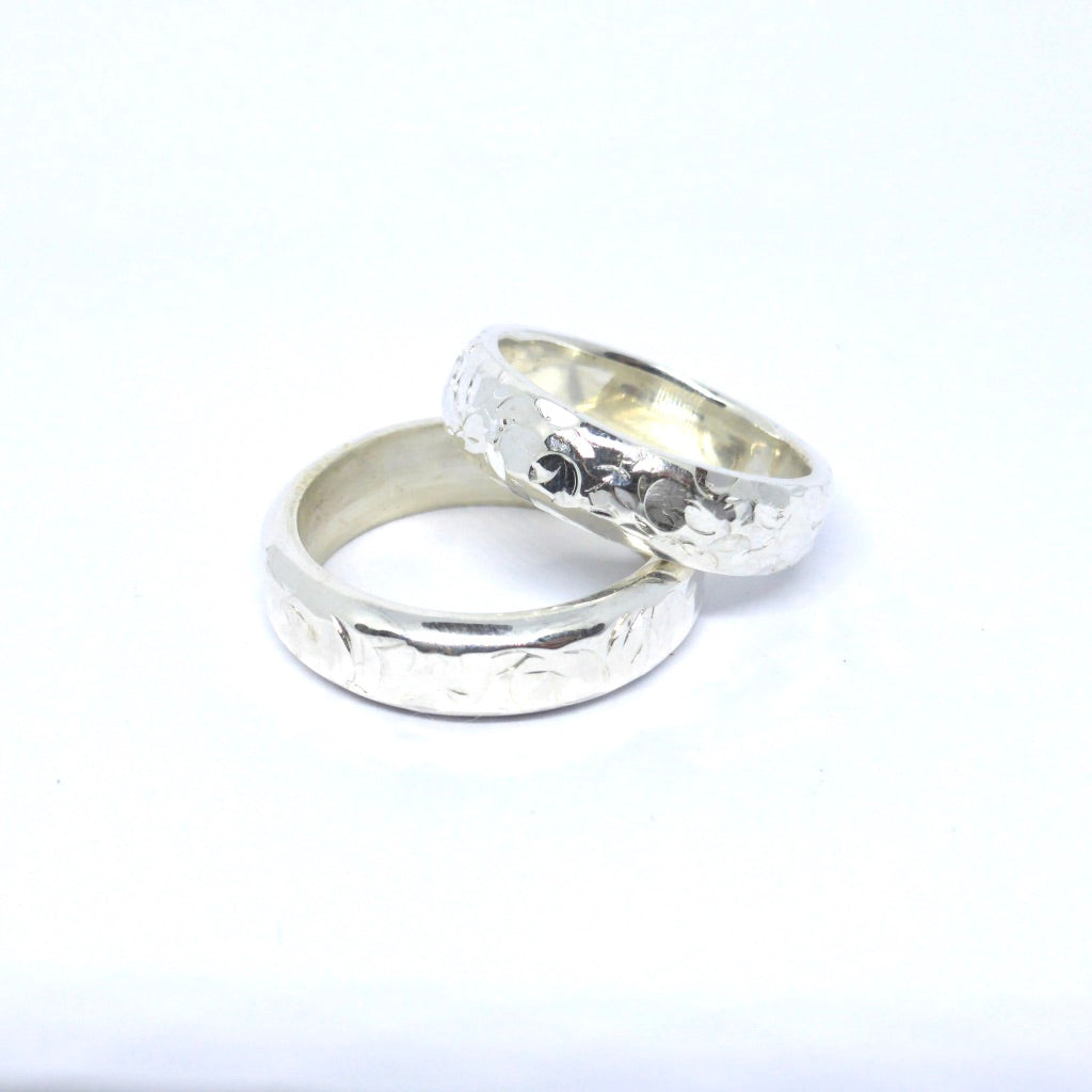 Sterling silver wedding bands with hammered textures 