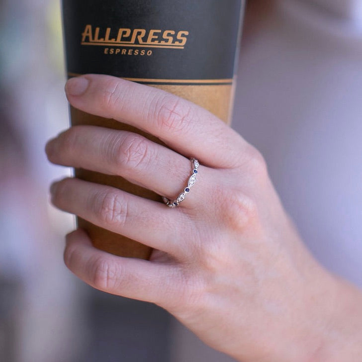 Diamonds set in white gold in feminine wedding ring by Louise Shaw Jewellery